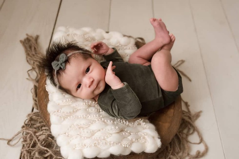 Awake newborn girl eye contact