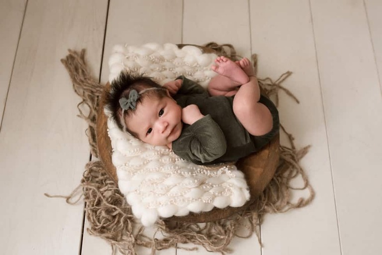 Awake newborn girl eye contact