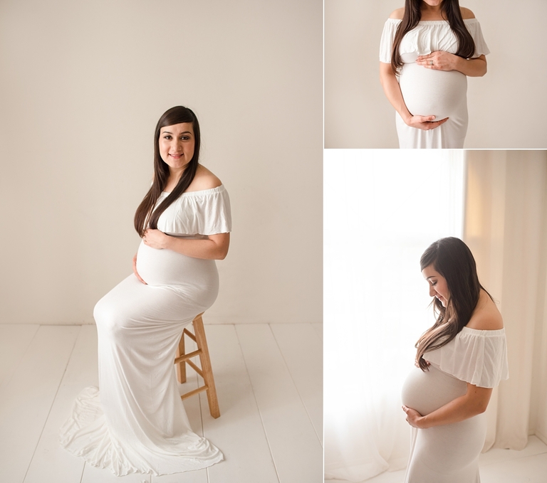 Maternity pose in white gown backlit with large soft light window. 