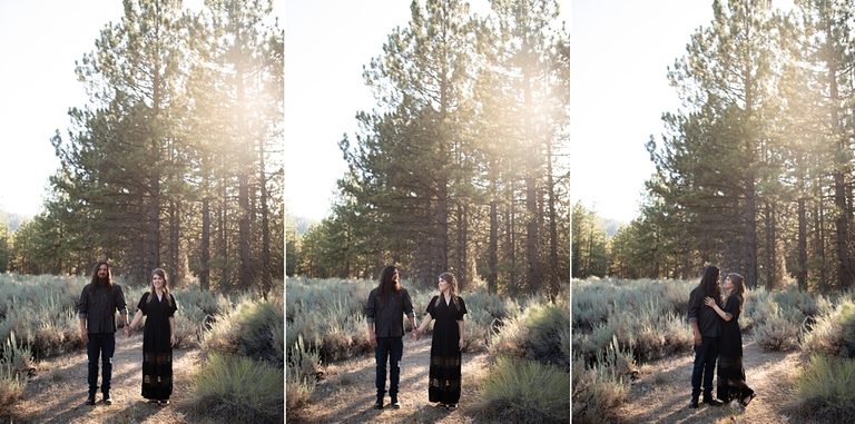 Couple standing in front of forest embracing for engagement photos